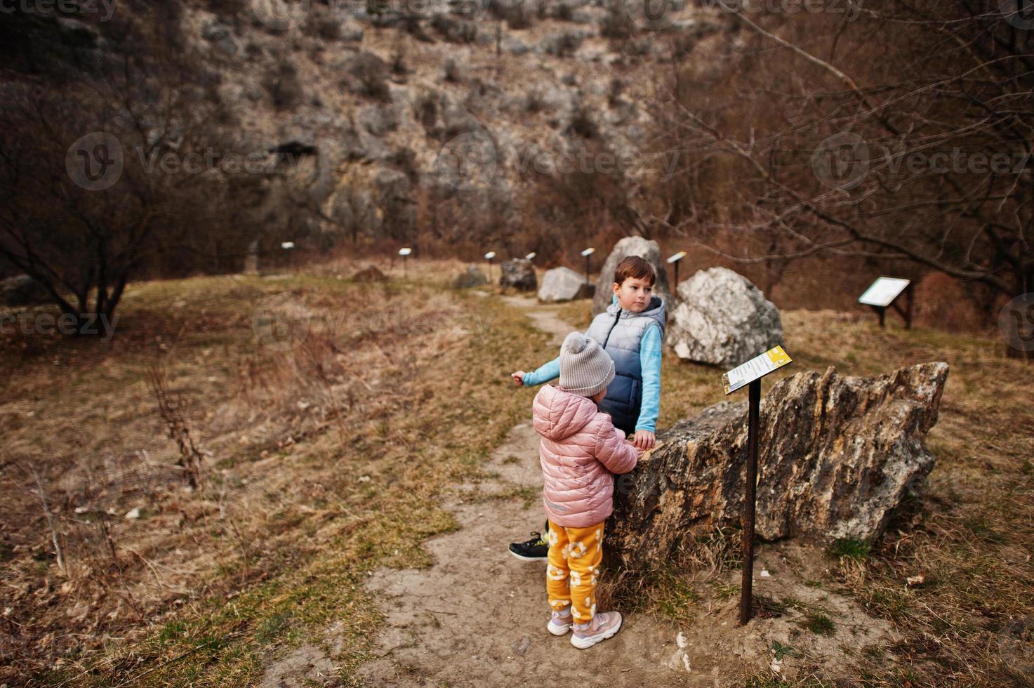 Kids at Turold science trail, Mikulov, Czech Republic learn types of rock breeds. photo