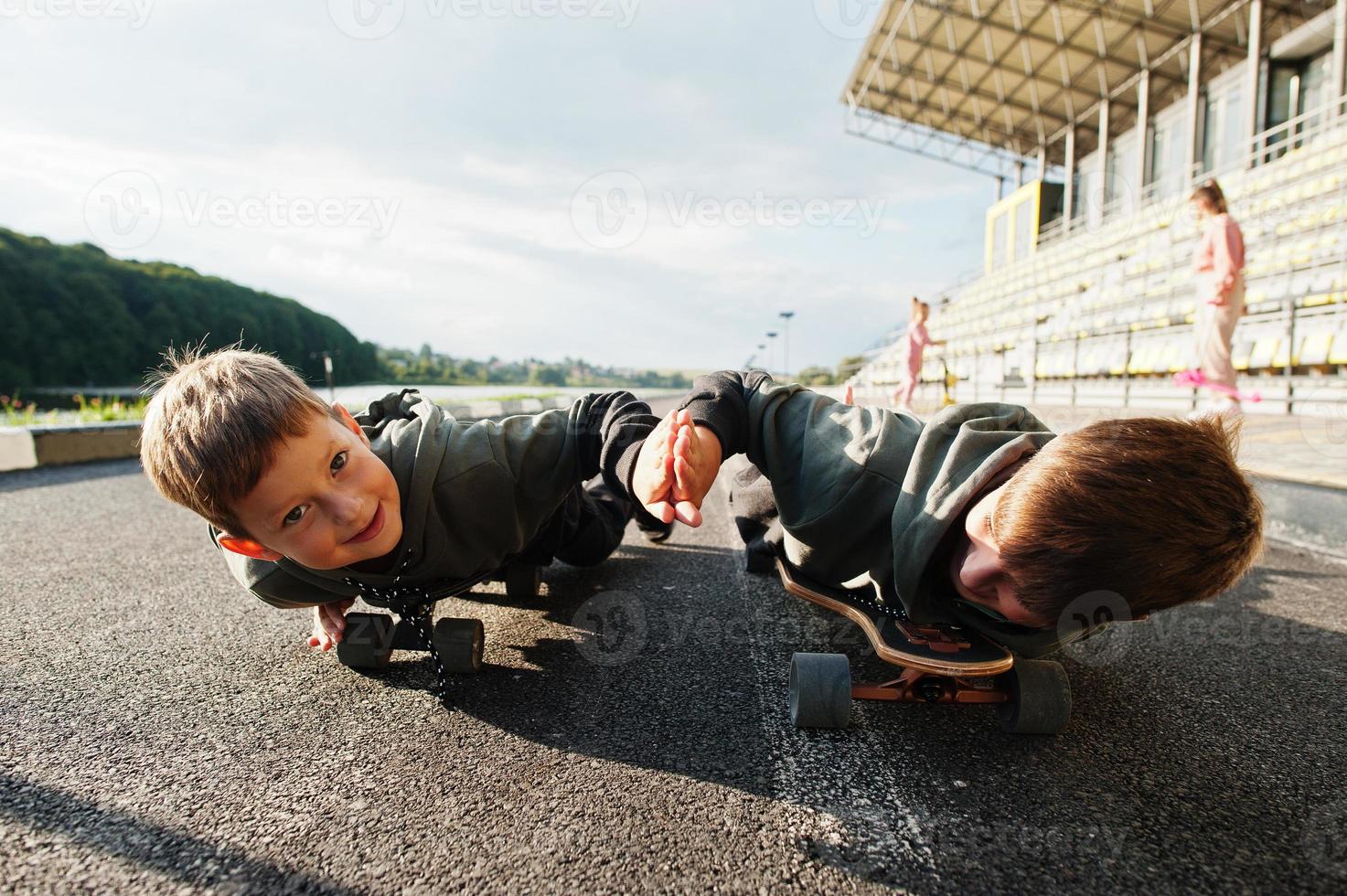 Two boys in skates. Brother's love. photo