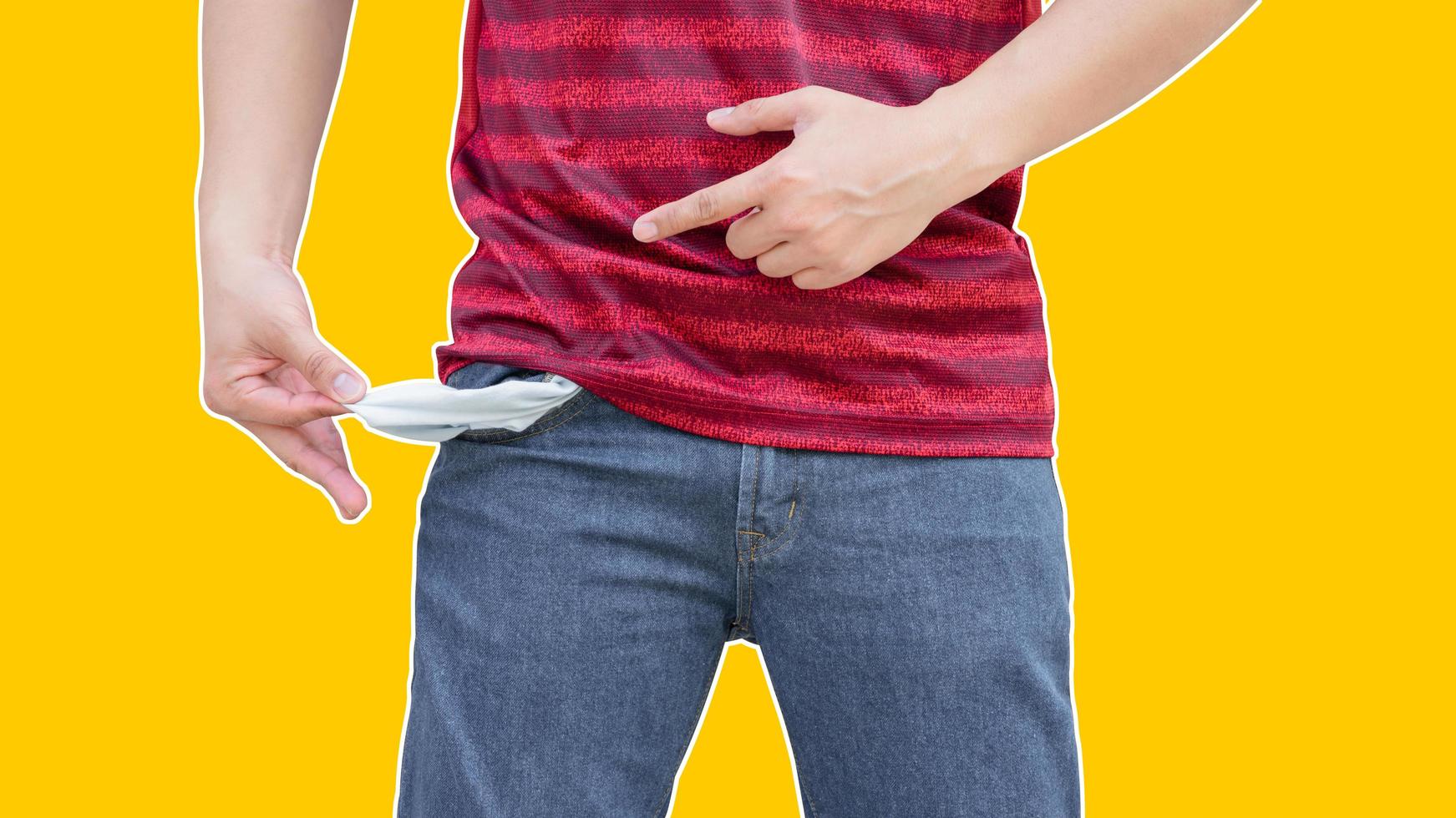 Man showing his empty pockets on yellow wall background. photo