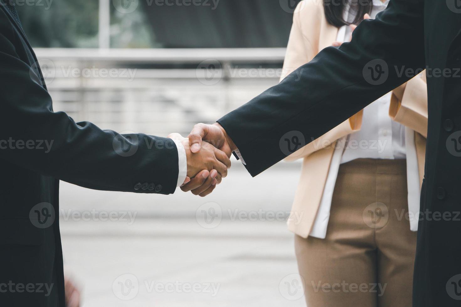 Success and Happiness Team Concept, Businessman handshake finishing up a meeting photo