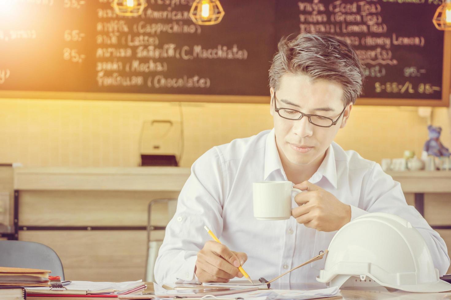 Close up of portrait engineering businessman working in coffee shop, Smart business concept photo