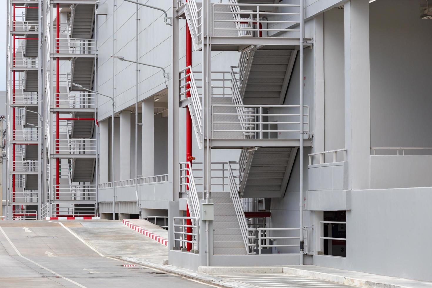 Side view on the exterior walkway and emergency exit stairs on the car park photo