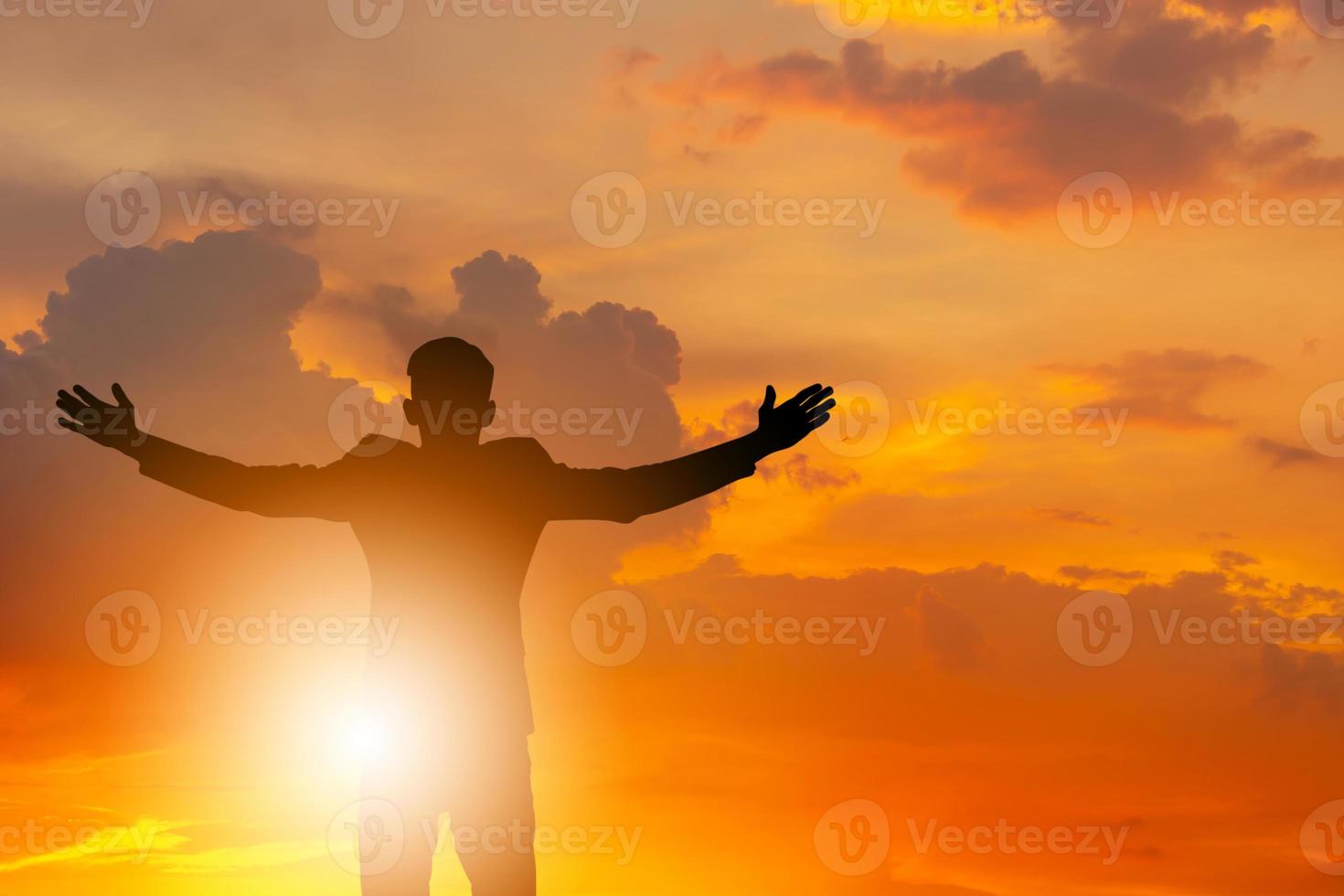 Silhouettes of Business Man Open Arms Under The Sunrise Sky Background, Celebration Success Happiness Concept, with Clipping Path. photo