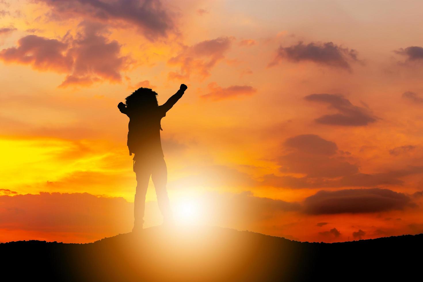 Silhouette of Man Celebration Success Happiness on a mountain top Evening Sky Sunset sunrise Background, Sport and active life Concept with clipping path photo
