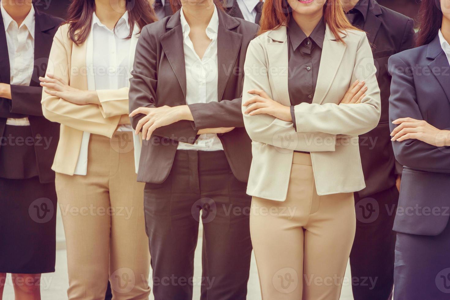 Success Teamwork Concept, Business people team standing with arms crossed city background. photo