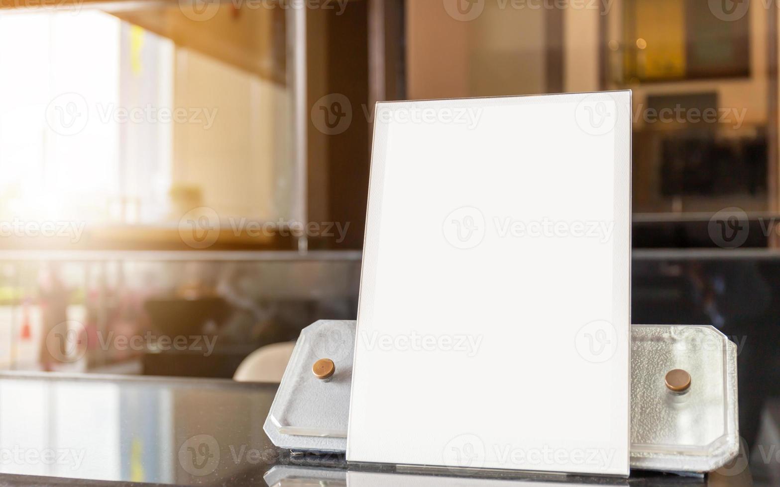 Blank flyer mockup glass plastic transparent holder poster display in hotel lobby photo