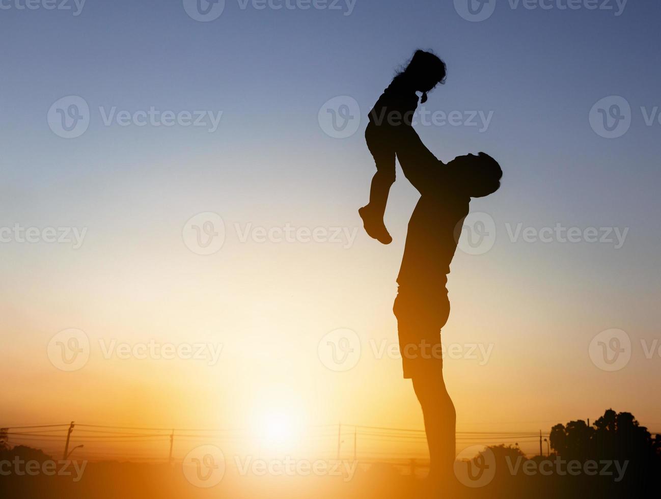 silhouette of a father and a daughter photo