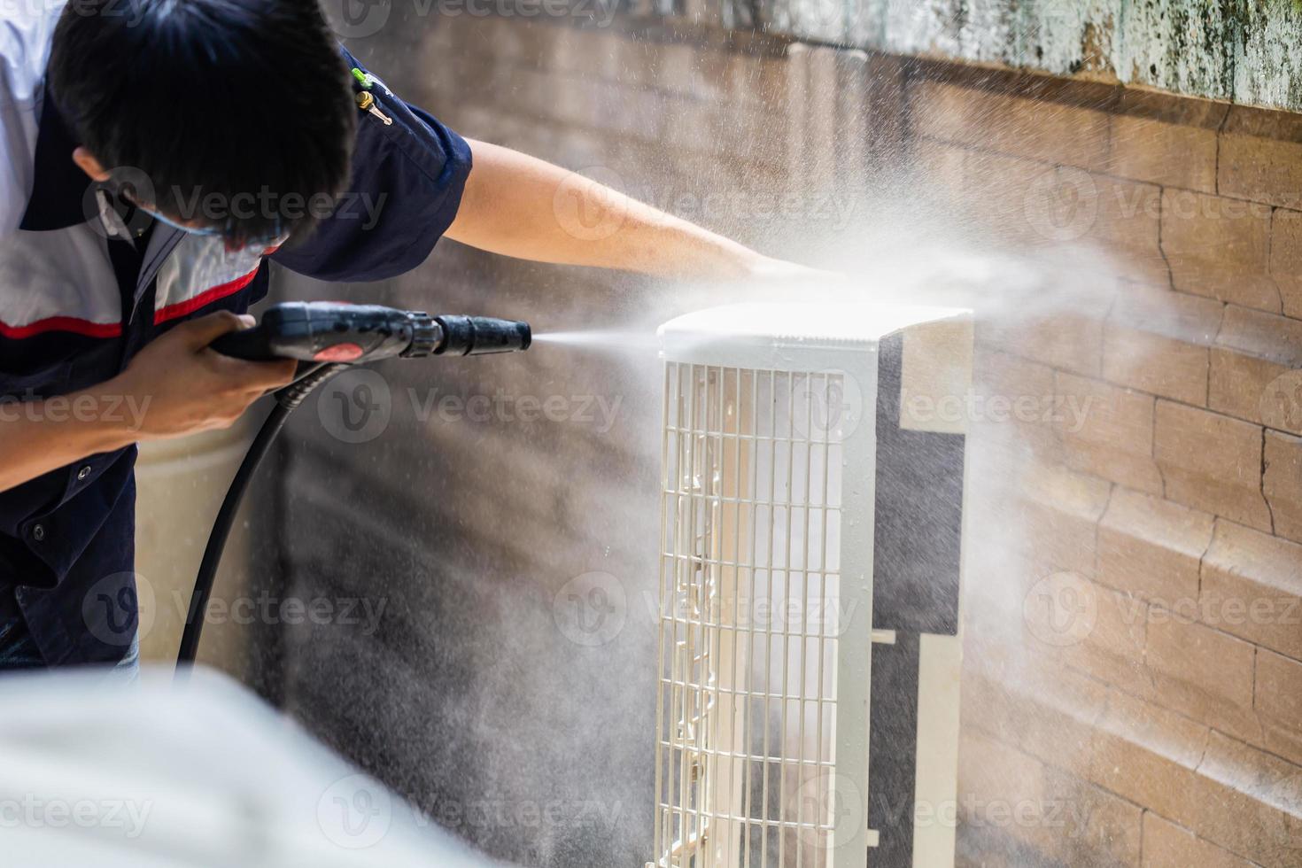 Repairman washing dirty compartments air conditioner, Male technician cleaning air conditioner indoors, Maintenance and repairing concepts photo