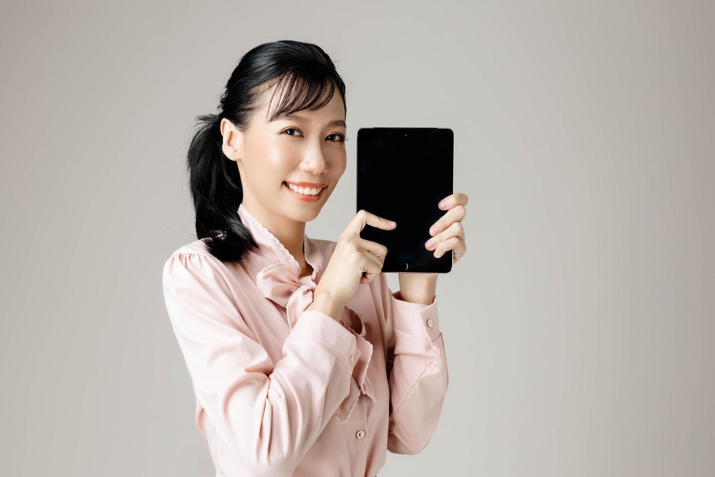 Young Asian office woman on isolated background. photo