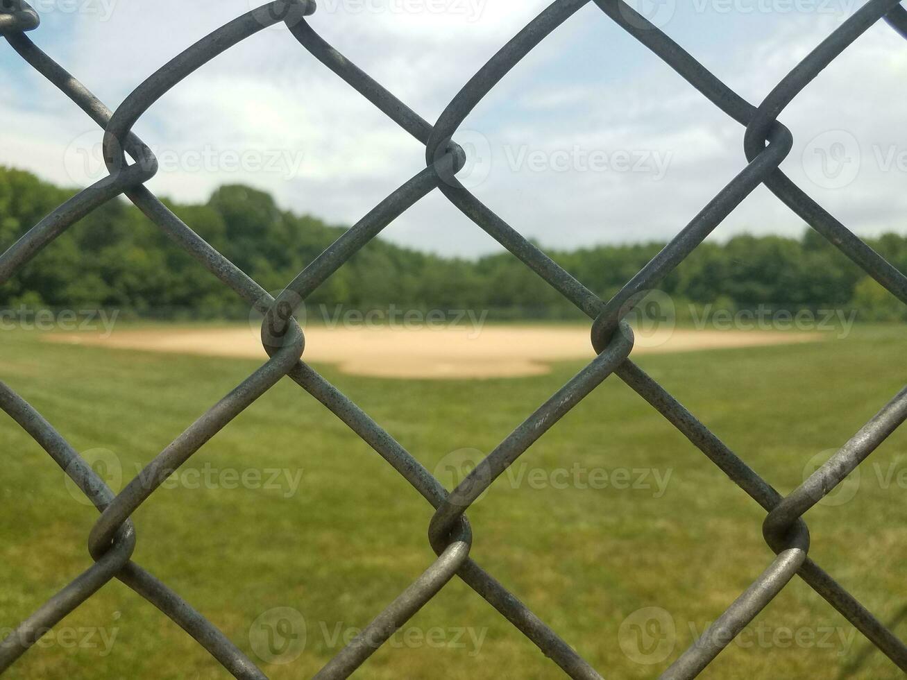 baseball diamond behind fence photo