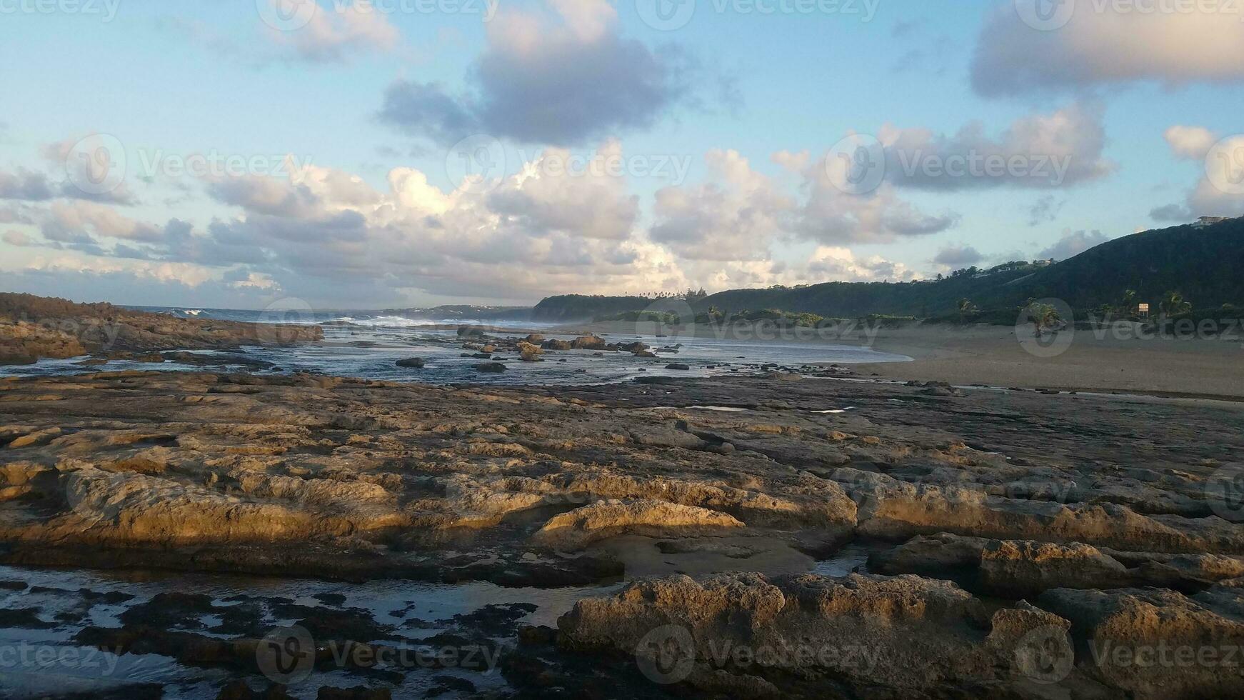 ocean water and waves with sand on beach in Isabela, Puerto Rico photo