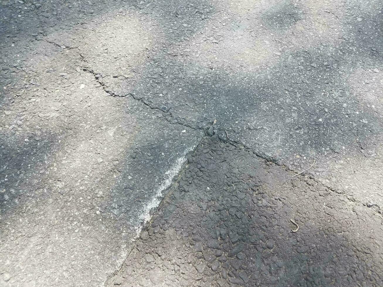 cracked asphalt road photo