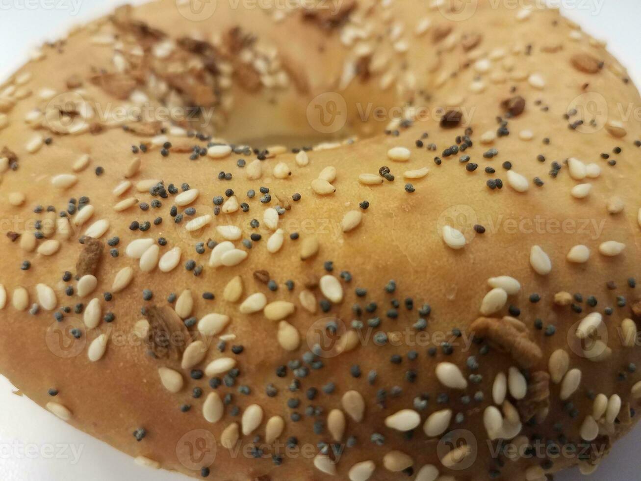 bagel with onion and sesame and poppy seeds photo