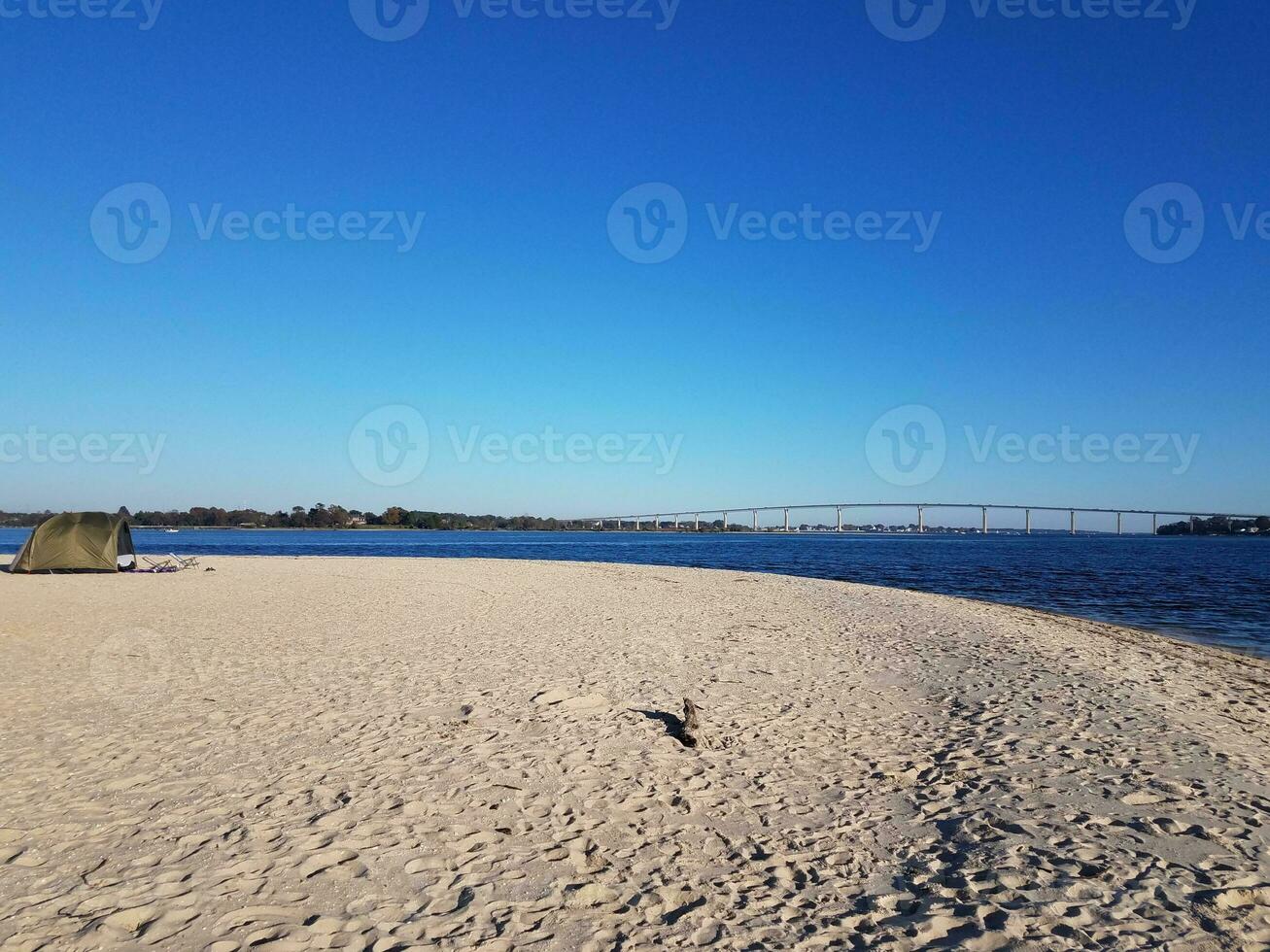 beach and water and bridge at Solomons Island Maryland with tent photo