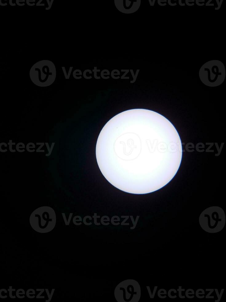 the sun viewed through a solar filter in a telescope photo