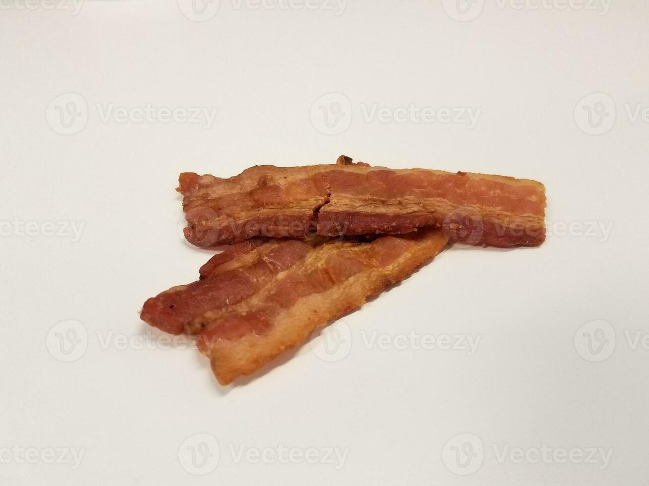 bacon strip or meat on white surface or table photo