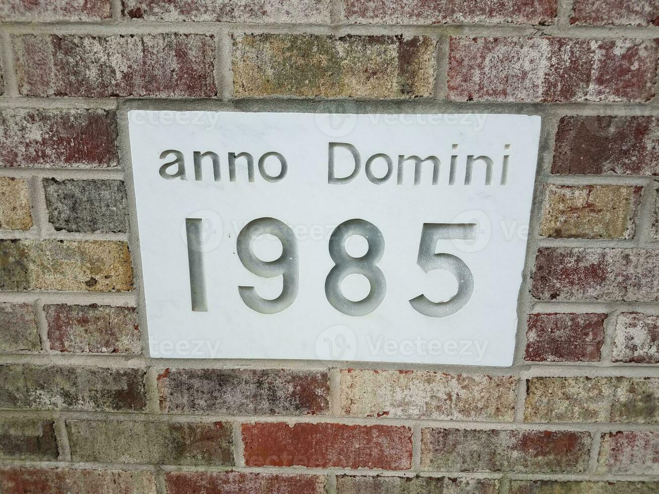 anno domini 1985 sign on brick wall photo