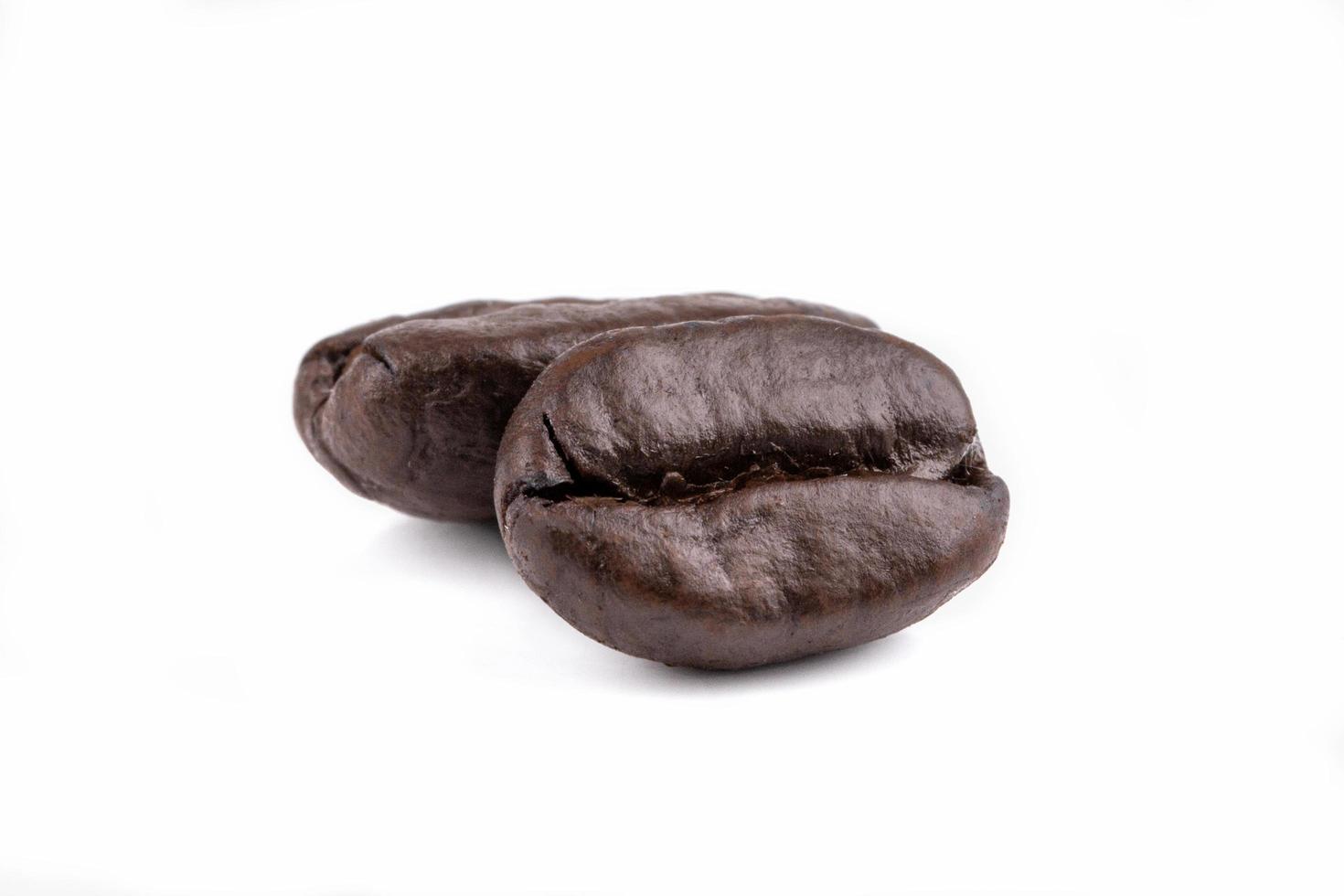 Isolated roasted coffee beans on white background photo