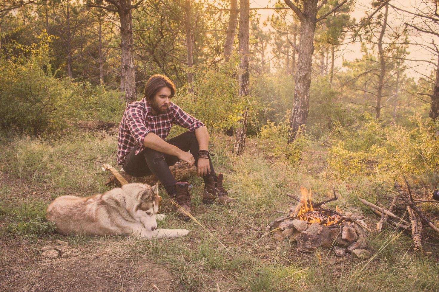 Young male traveler with husky dog photo