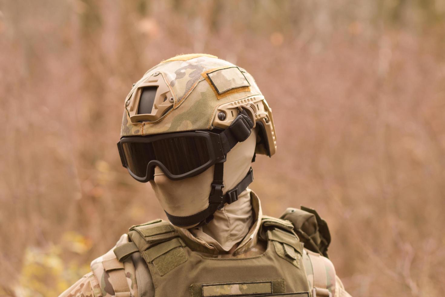 Male from private military company with rifle in the forest photo