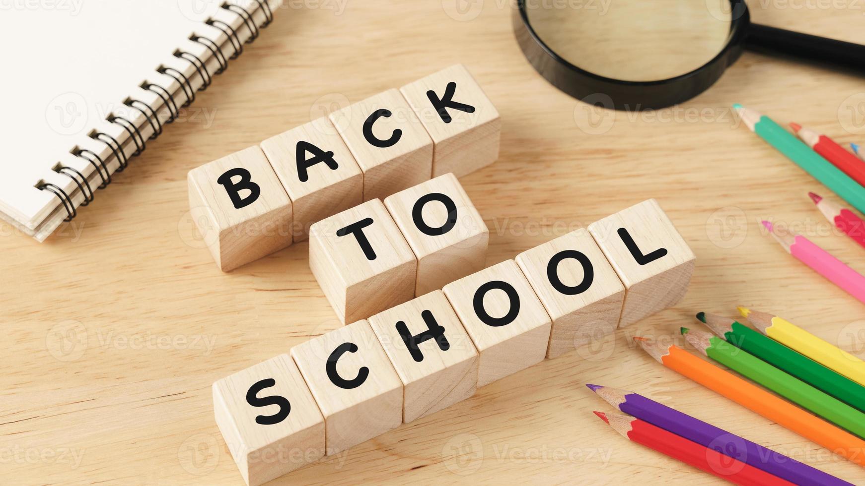 School supplies on wooden table background. Back to school concept. photo
