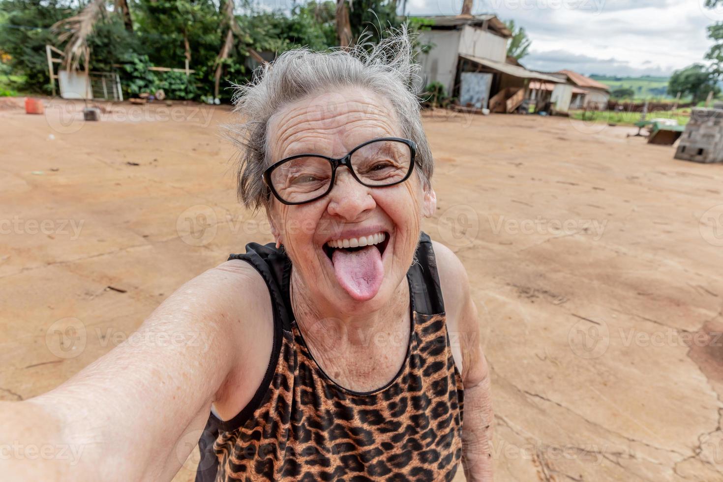 Elderly woman farmer taking a selfie. photo