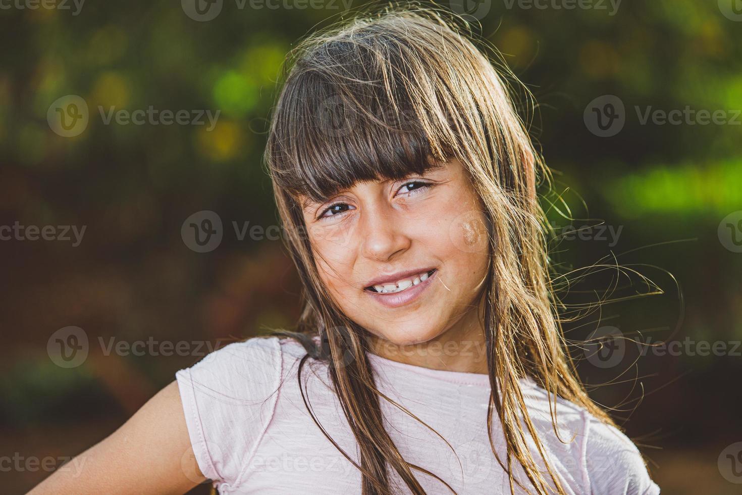 Portrait of smiling beautiful young girl at farm. Girl at farm in summer day. Gardening activity. Brazilian girl. photo