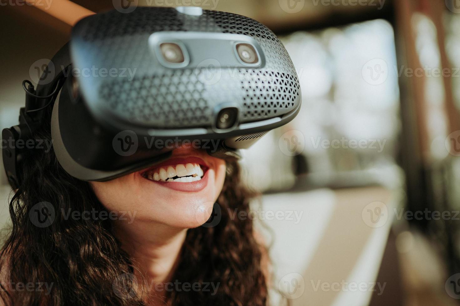 Latin woman with virtual reality glasses. Future technology concept. photo