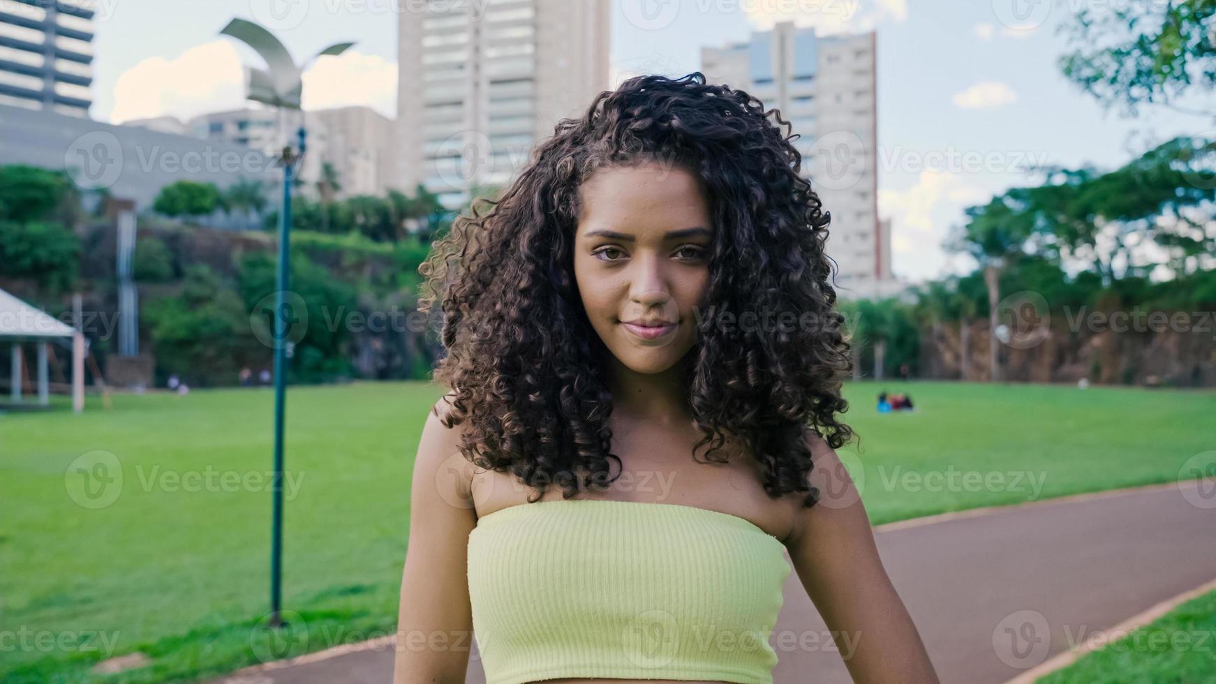 Smiling young latin woman. Joy, positive and love. Beautiful Brazilian girl. photo