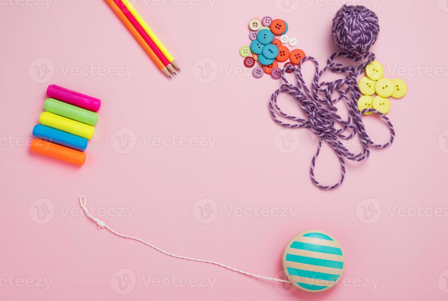 Creative flat lay of hobby time and art tools on a colorful pink background. Copy space photo