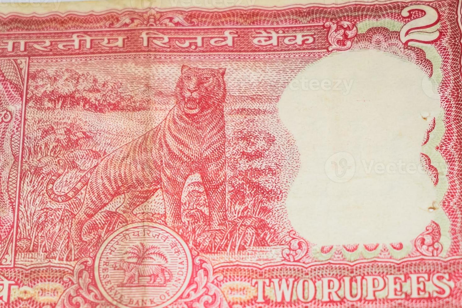 Old Two Rupee notes combined on the table, India money on the rotating table. Old Indian Currency notes on a rotating table, Indian Currency on the table photo