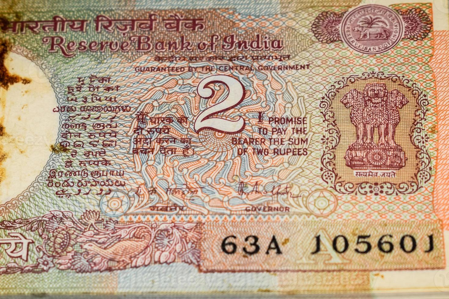 Old Two Rupee notes combined on the table, India money on the rotating table. Old Indian Currency notes on a rotating table, Indian Currency on the table photo