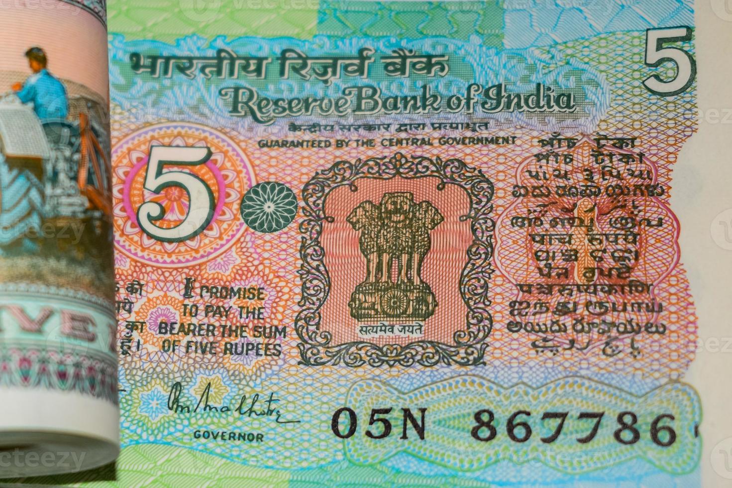 Old Five Rupee notes combined on the table, India money on the rotating table. Old Indian Currency notes on a rotating table, Indian Currency on the table photo