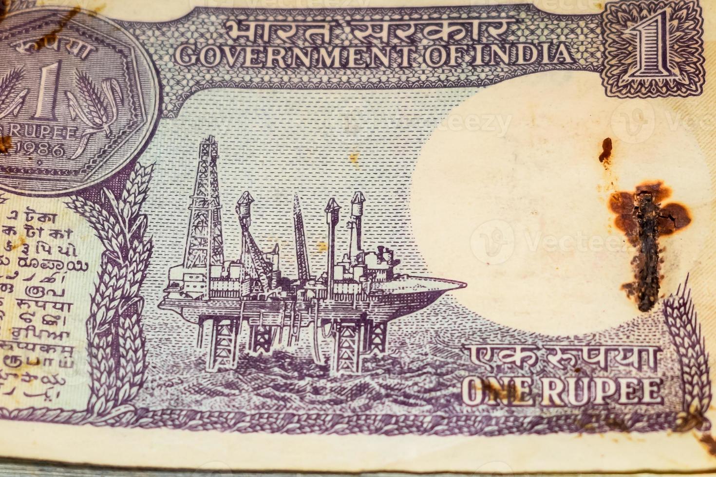 Old One Rupee notes combined on the table, India money on the rotating table. Old Indian Currency notes on a rotating table, Indian Currency on the table photo