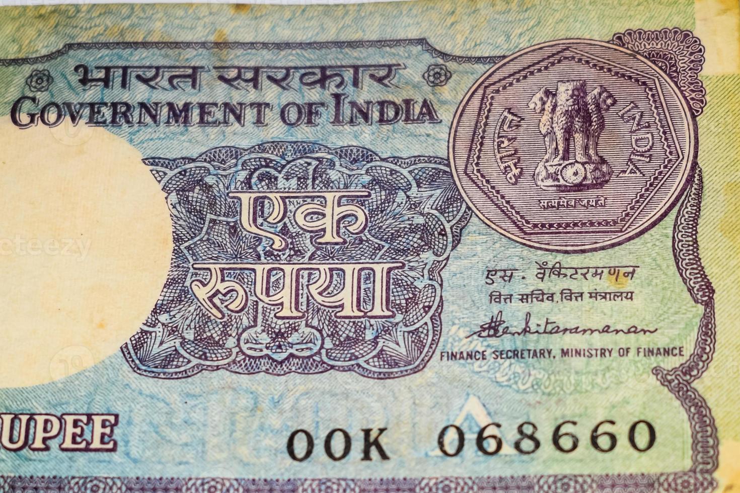 Old One Rupee notes combined on the table, India money on the rotating table. Old Indian Currency notes on a rotating table, Indian Currency on the table photo