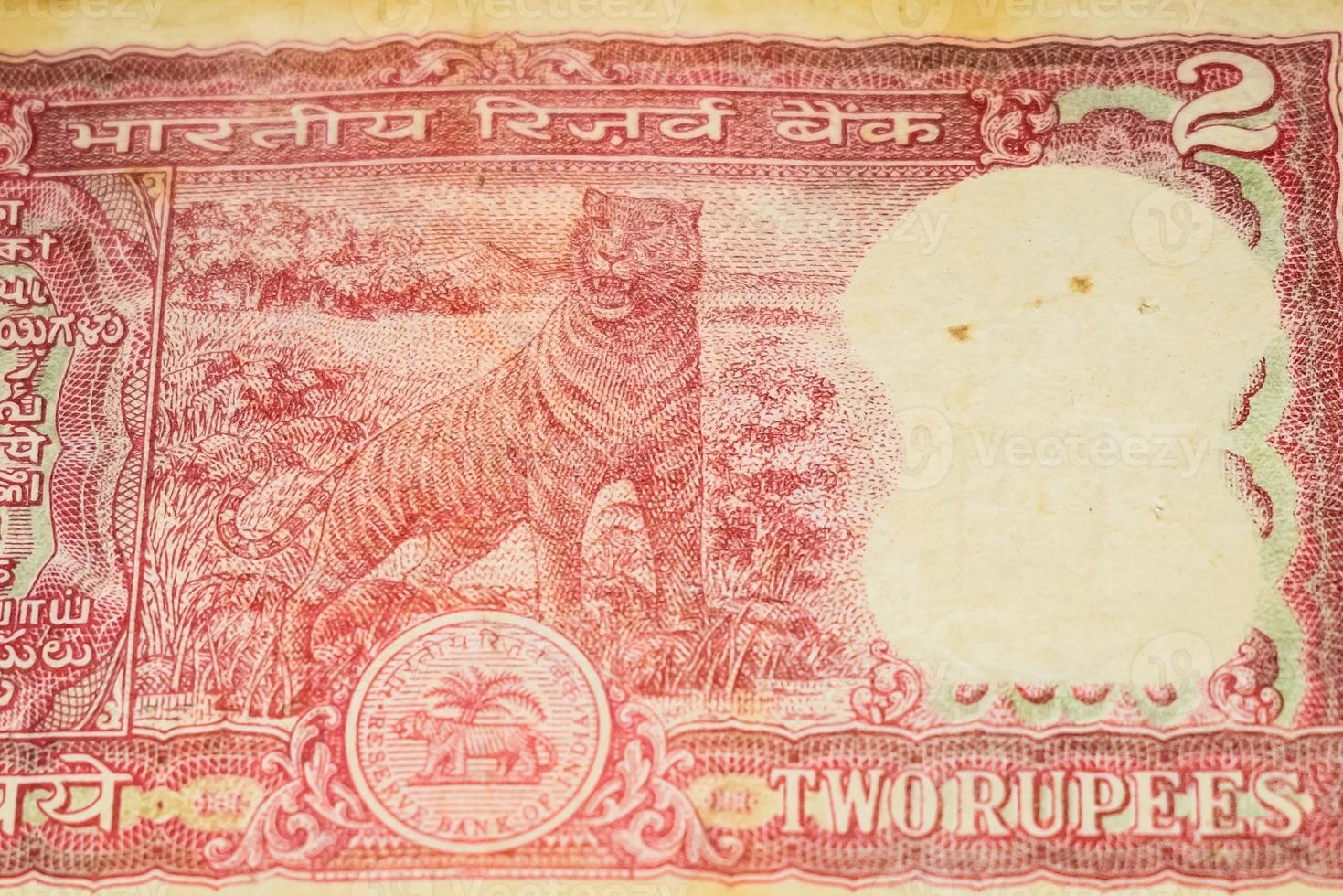 Old Two Rupee notes combined on the table, India money on the rotating table. Old Indian Currency notes on a rotating table, Indian Currency on the table photo