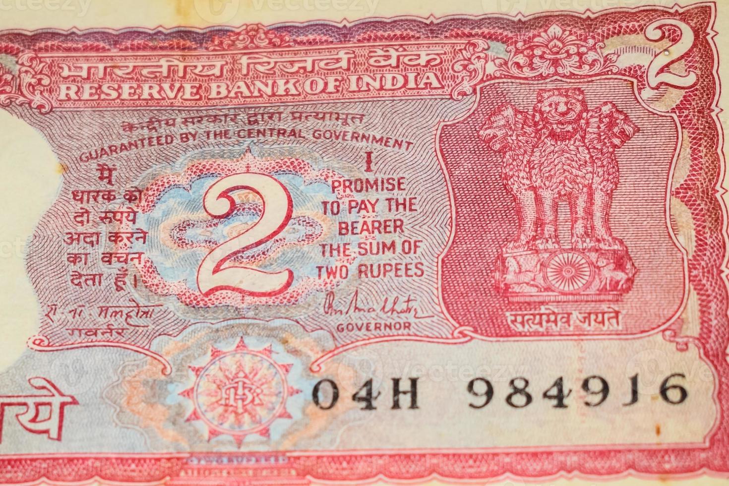 Old Two Rupee notes combined on the table, India money on the rotating table. Old Indian Currency notes on a rotating table, Indian Currency on the table photo