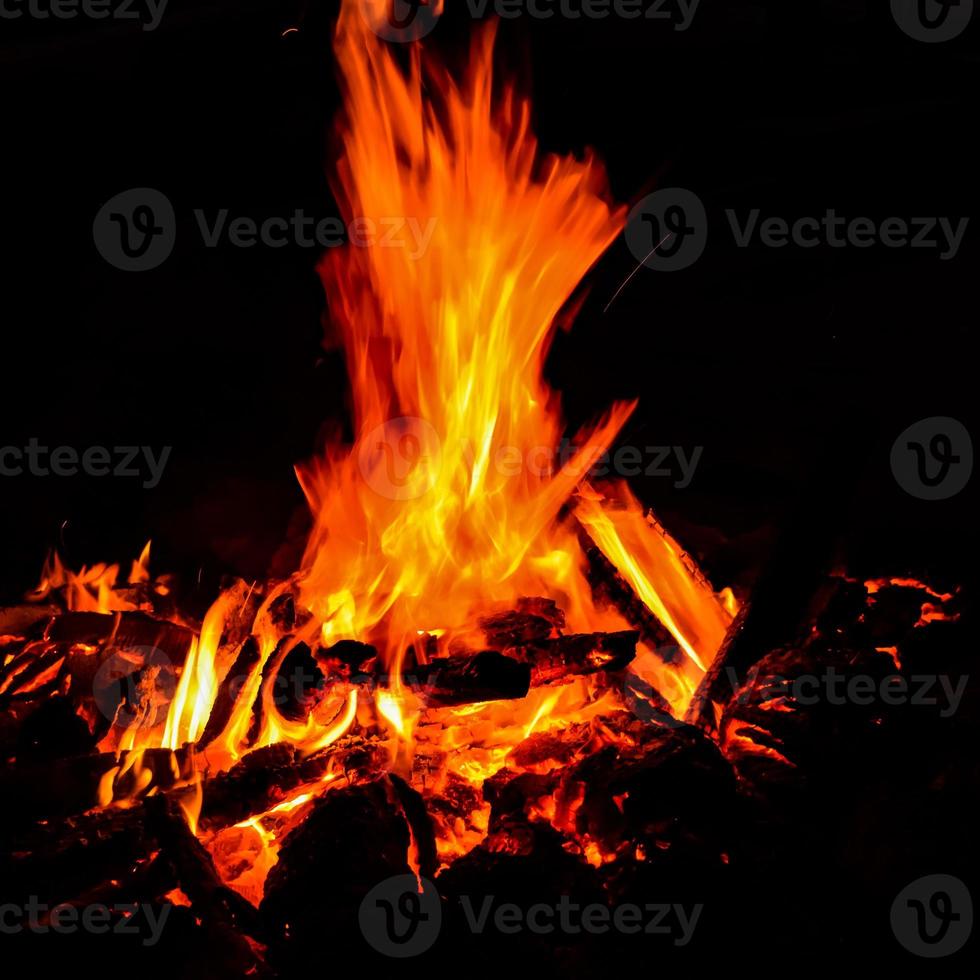 Fire flames on black background, Blaze fire flame texture background, Beautifully, the fire is burning, Fire flames with wood and cow dung bonfire photo