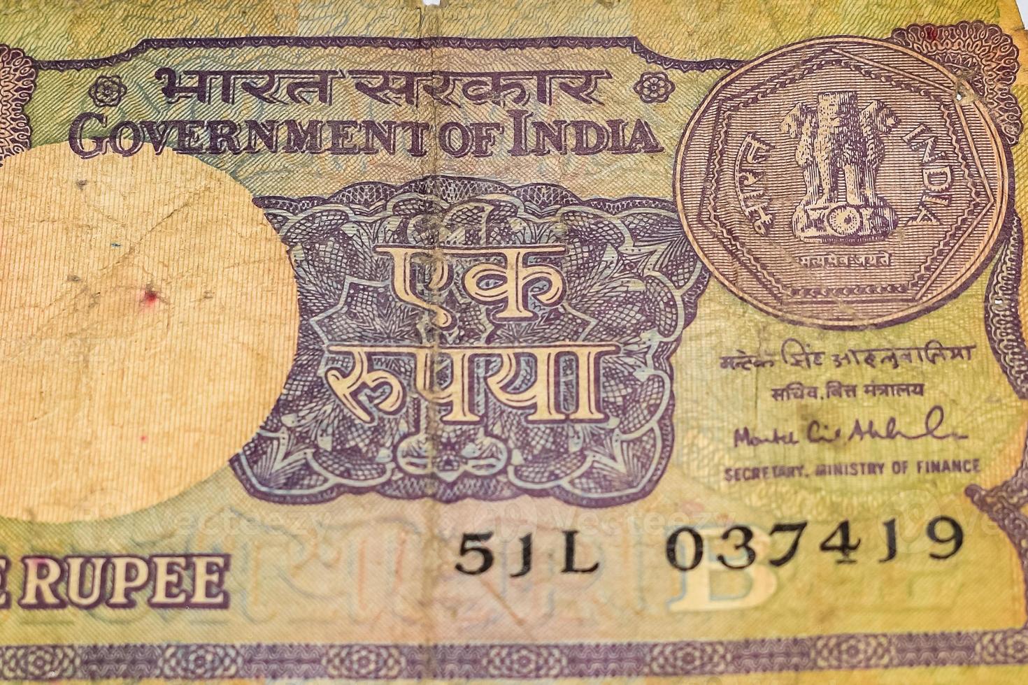 Old One Rupee notes combined on the table, India money on the rotating table. Old Indian Currency notes on a rotating table, Indian Currency on the table photo