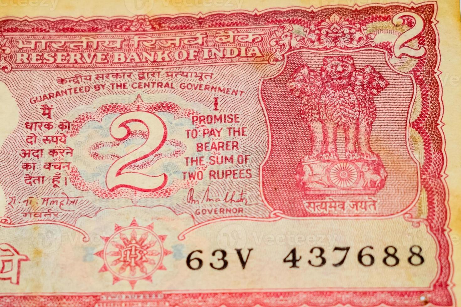 Old Two Rupee notes combined on the table, India money on the rotating table. Old Indian Currency notes on a rotating table, Indian Currency on the table photo