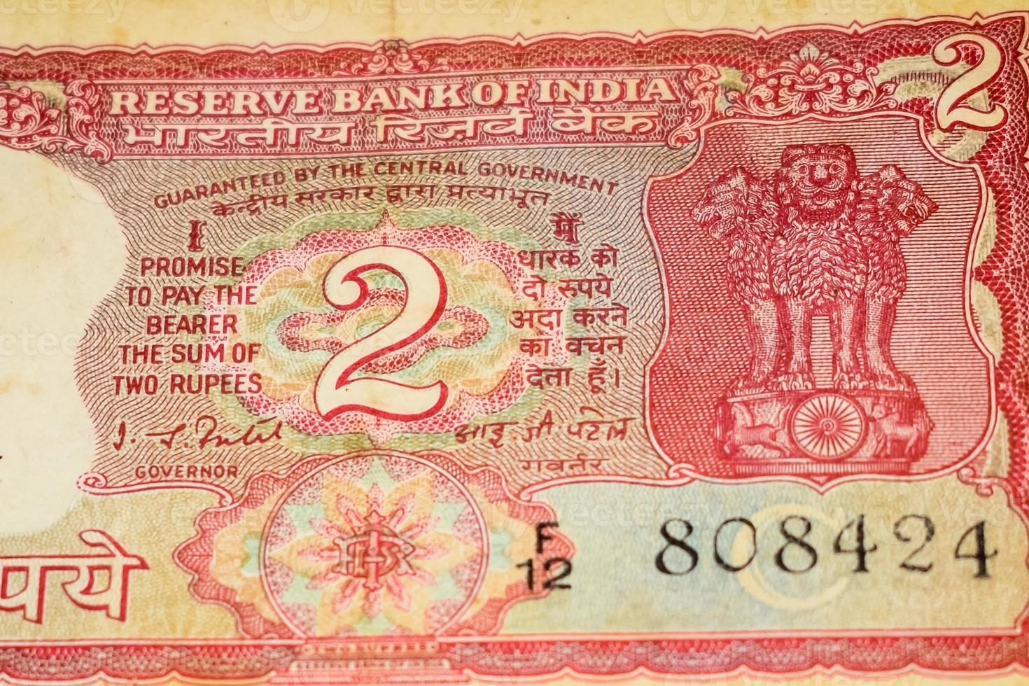 Old Two Rupee notes combined on the table, India money on the rotating table. Old Indian Currency notes on a rotating table, Indian Currency on the table photo