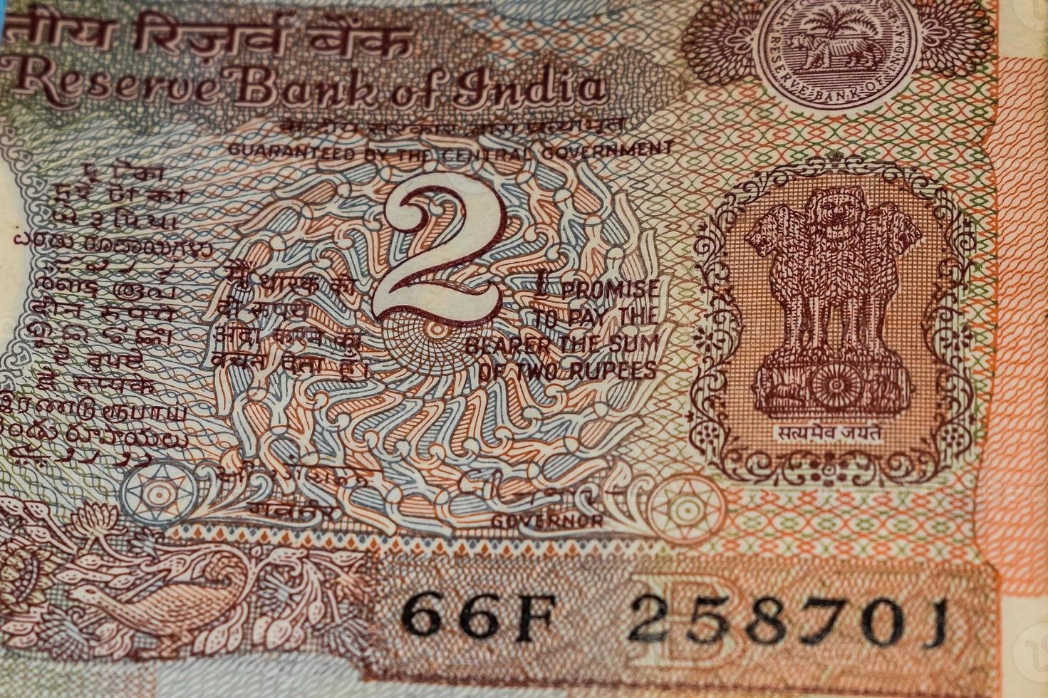 Old Two Rupee notes combined on the table, India money on the rotating table. Old Indian Currency notes on a rotating table, Indian Currency on the table photo