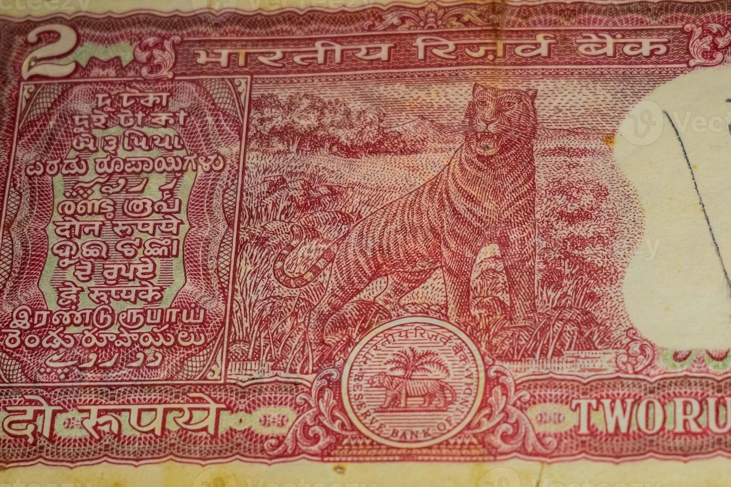 Old Two Rupee notes combined on the table, India money on the rotating table. Old Indian Currency notes on a rotating table, Indian Currency on the table photo