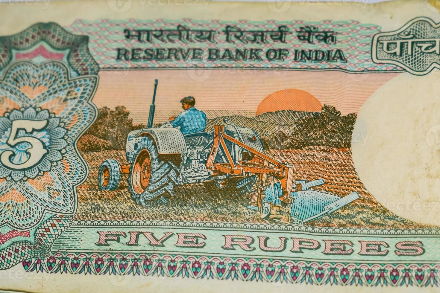 Old Five Rupee notes combined on the table, India money on the rotating table. Old Indian Currency notes on a rotating table, Indian Currency on the table photo