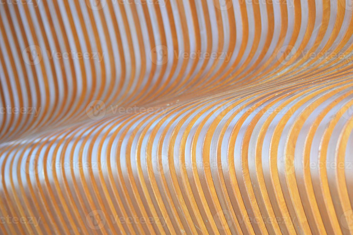 Sunlight and shadows on the surface of vertical wooden slats. Wooden boards that change angle. Abstract wooden background. photo