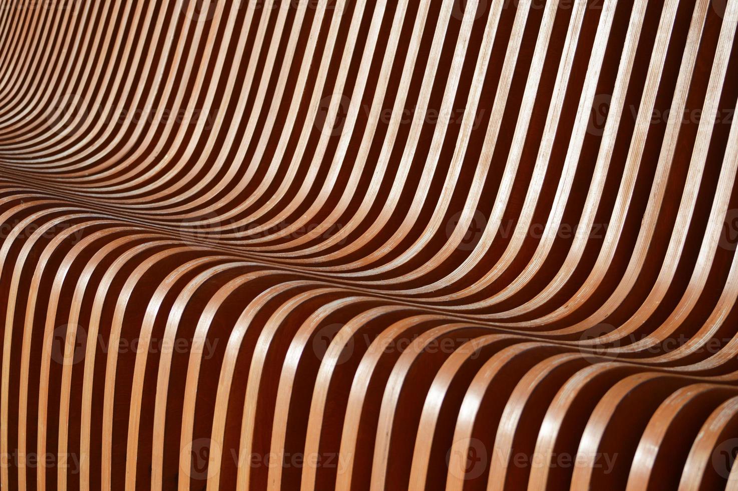 Curved wooden slats. Beautiful gradient from brown to green. Abstract background. photo