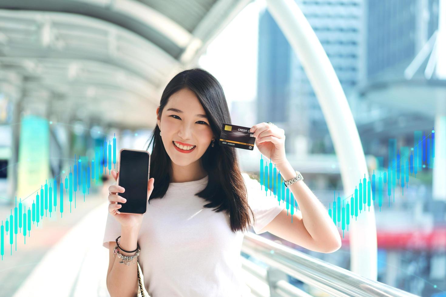 Young adult business woman consumer holding smartphone blank screen space for mockup. photo