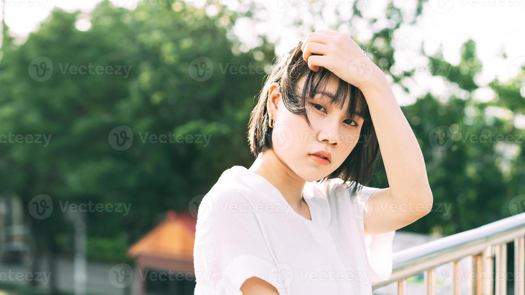 Portrait of young adult asian business woman looking camera. photo