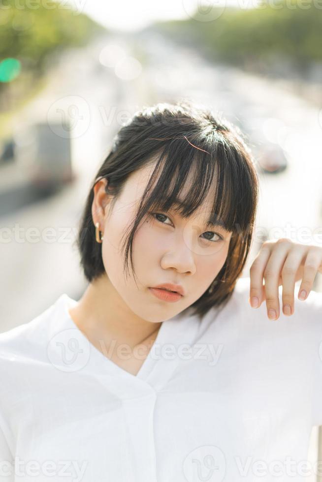 Portrait of young adult asian business woman looking camera. photo