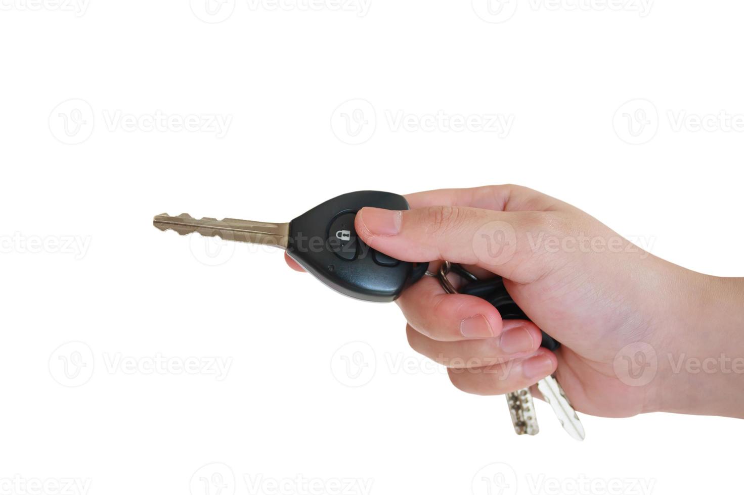 women's hand presses on the remote control car alarm systems photo